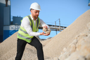 An engineer assessing aggregate selection at construction