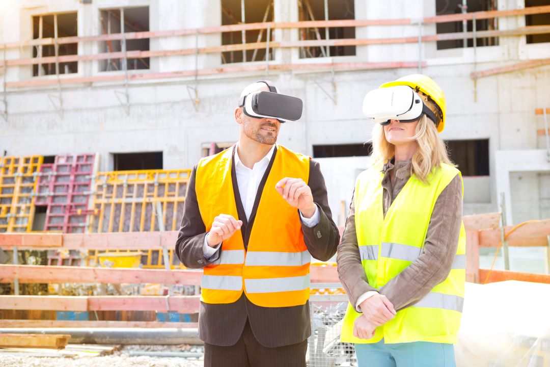 ai in construction industry, 2 workers wearing a VR set on a construction site