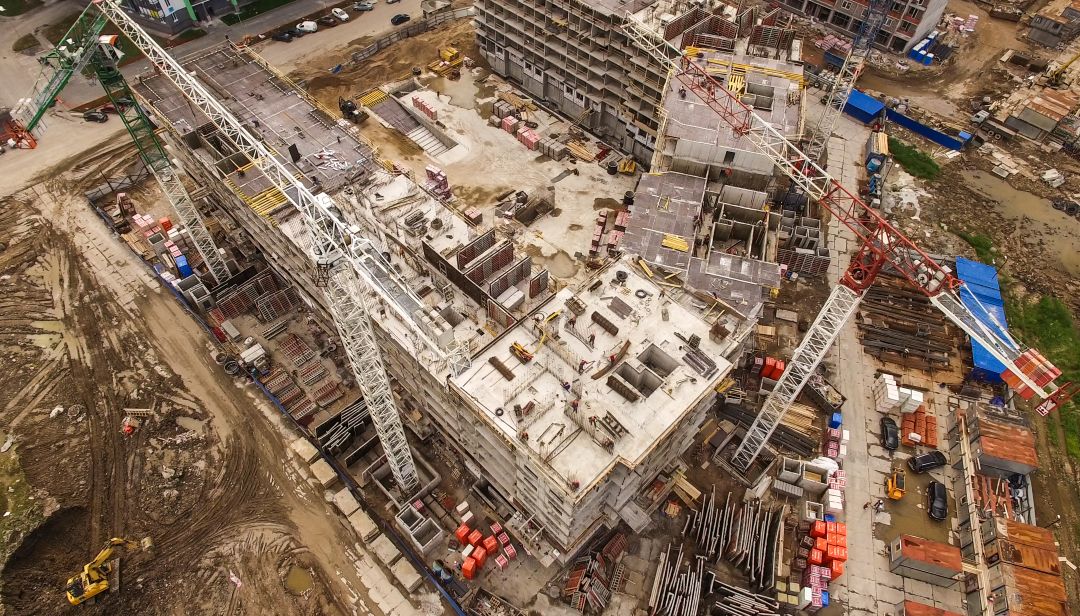 how contractors manage aggregate procurement, an aerial view of a large-scale construction site
